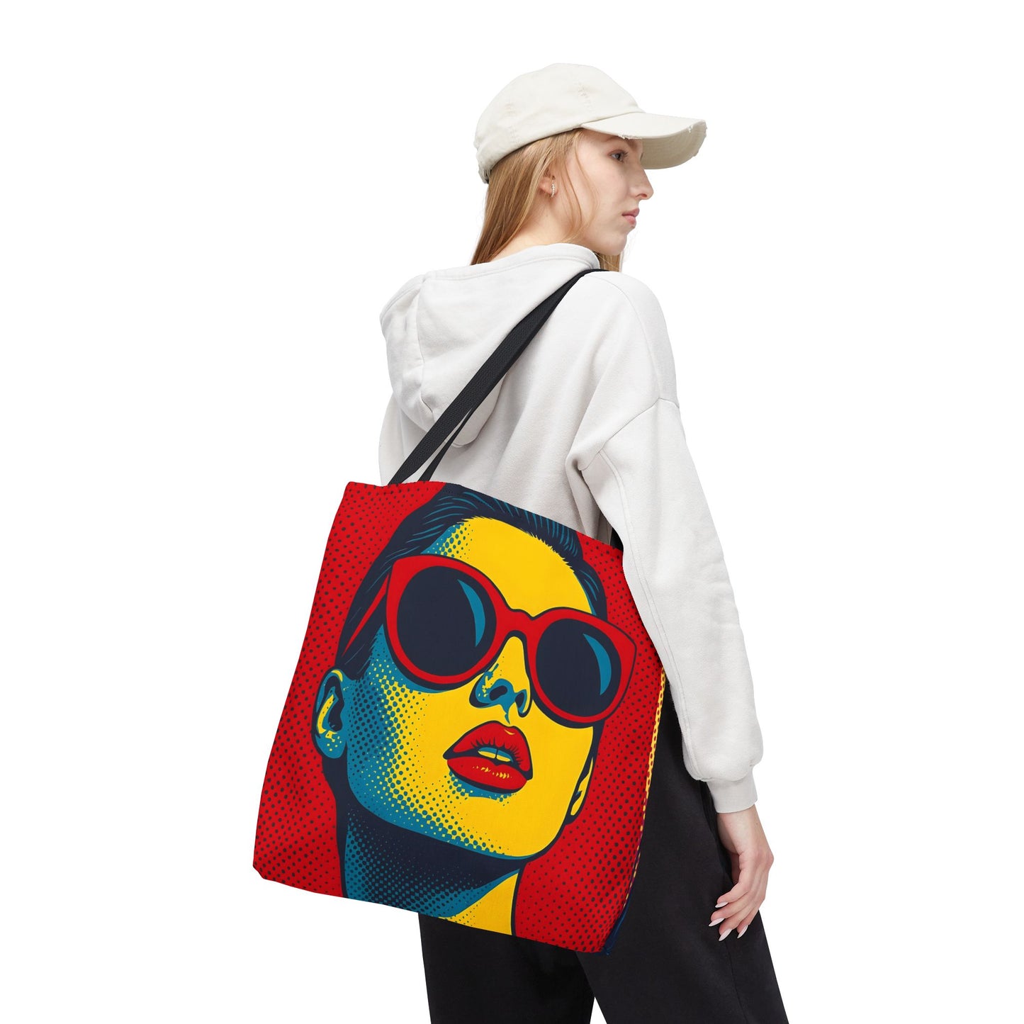 Person wearing a white hoodie and a colorful tote bag with a pop art 60s graphic design on a white background