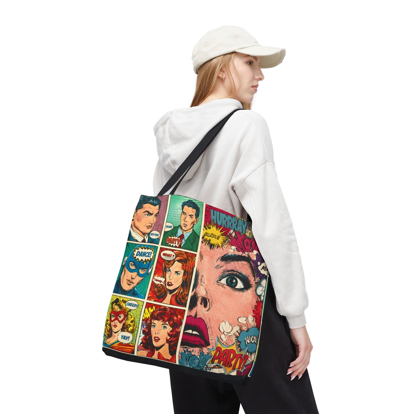 Person wearing a white hoodie and cap, holding a colorful classic comic book design tote bag .