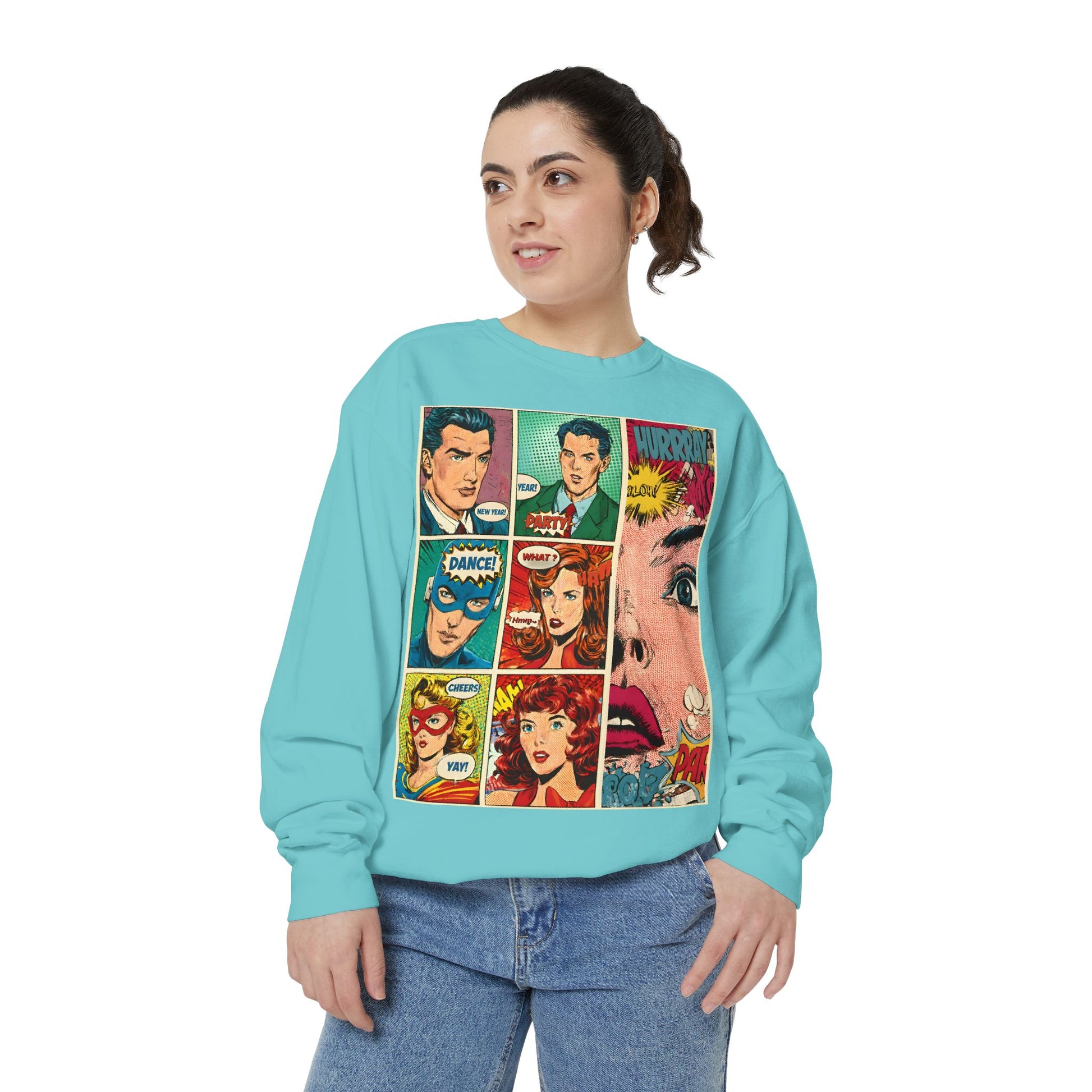 Person wearing a turquoise sweatshirt with comic book-style graphics on a white background
