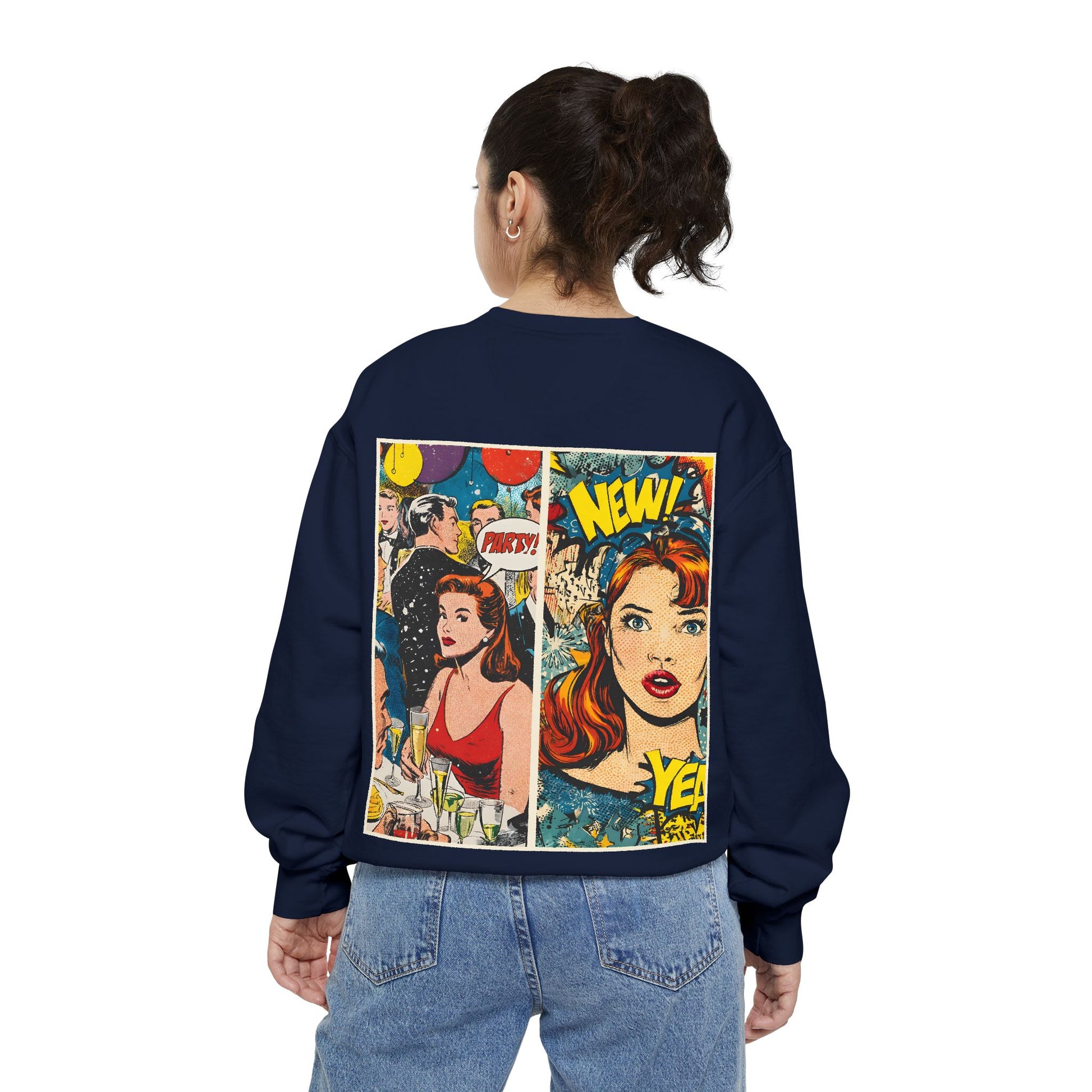 Person wearing a navy sweatshirt with comic book-style design on the back, standing against a white background.