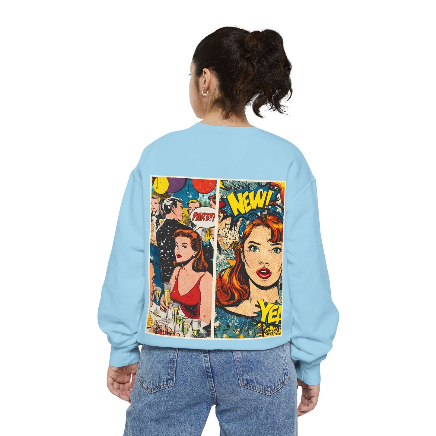 Light blue sweatshirt with comic book design on the back, worn by a person.