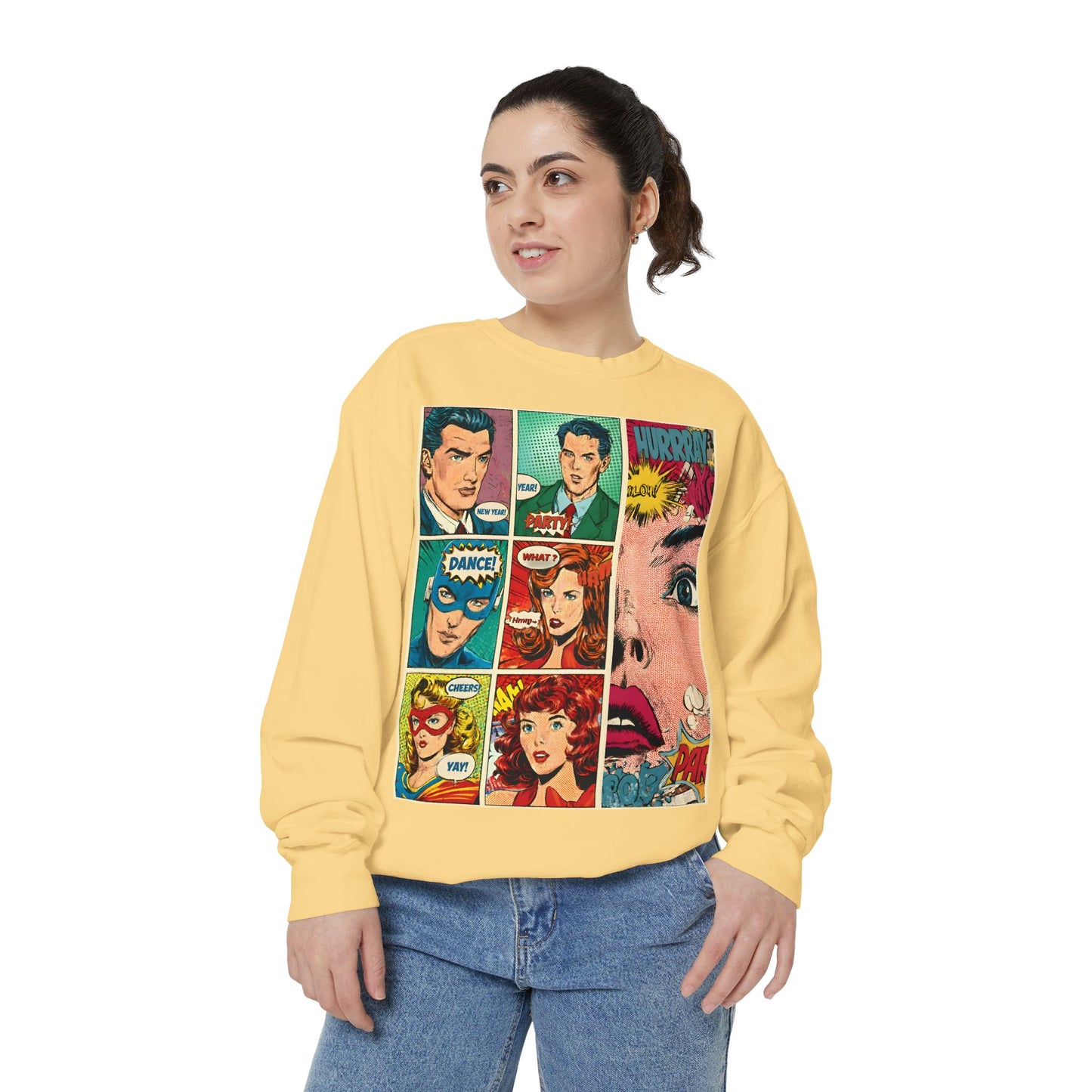 Person wearing a yellow sweatshirt with comic book character designs on a white background