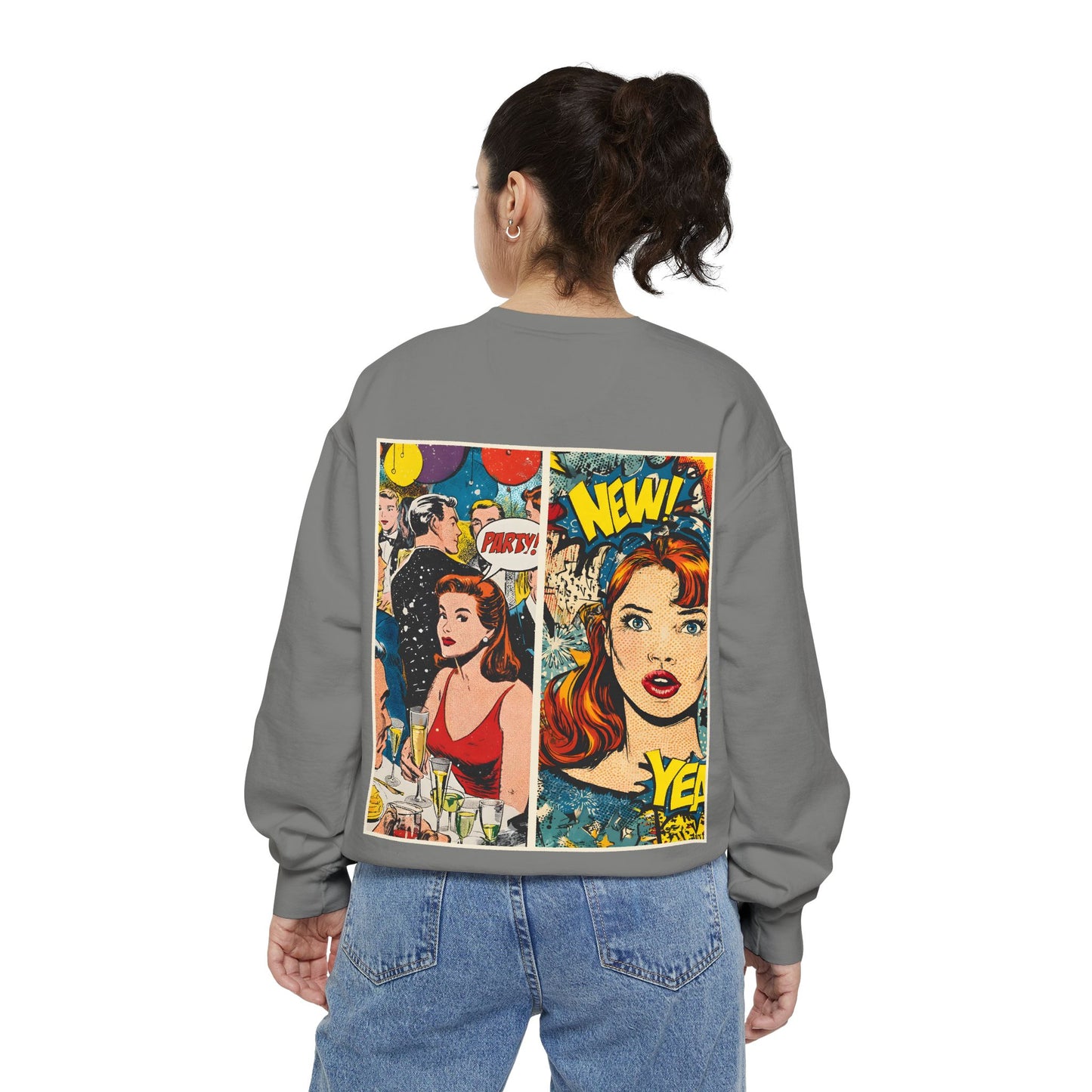 Person wearing a gray sweatshirt with comic book-style graphics on the back