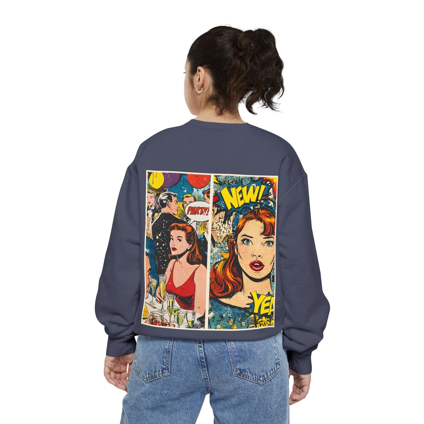 Person wearing a denim color sweatshirt with comic book-style graphics on the back