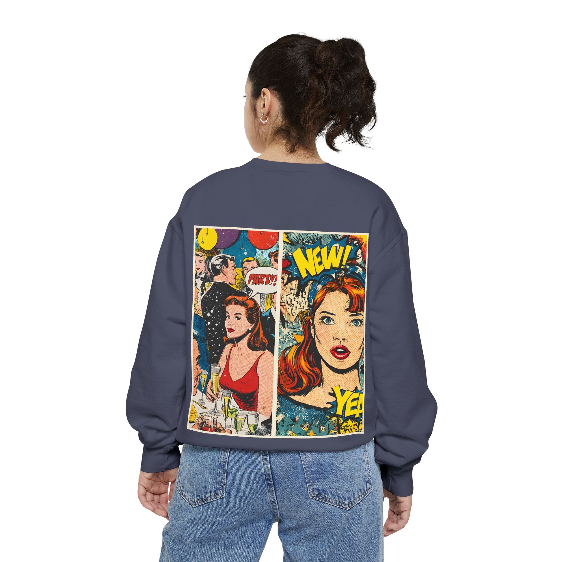 Person wearing a denim color sweatshirt with comic book-style graphics on the back