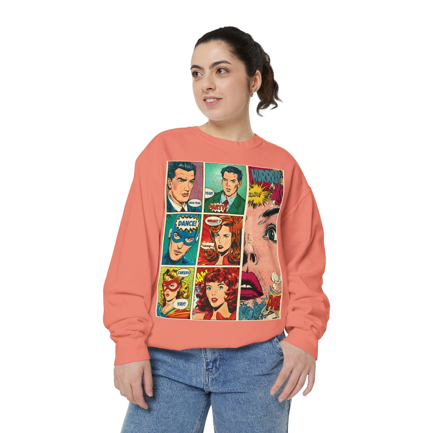 Person wearing a peach-colored sweatshirt with comic book-style graphics on a white background