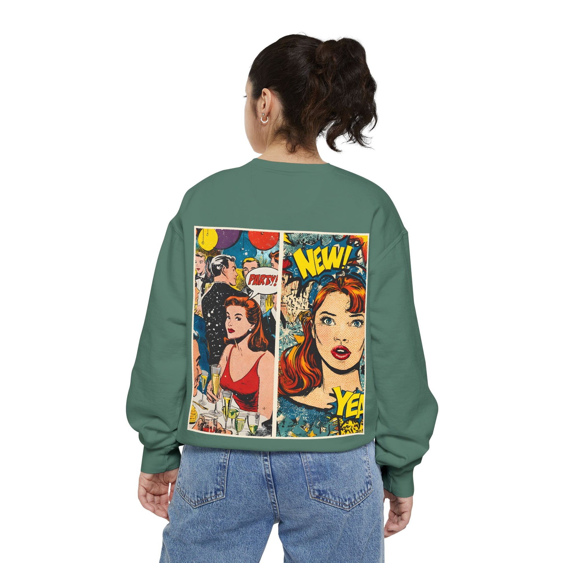 Person wearing a green sweatshirt with comic book-style graphics on the back